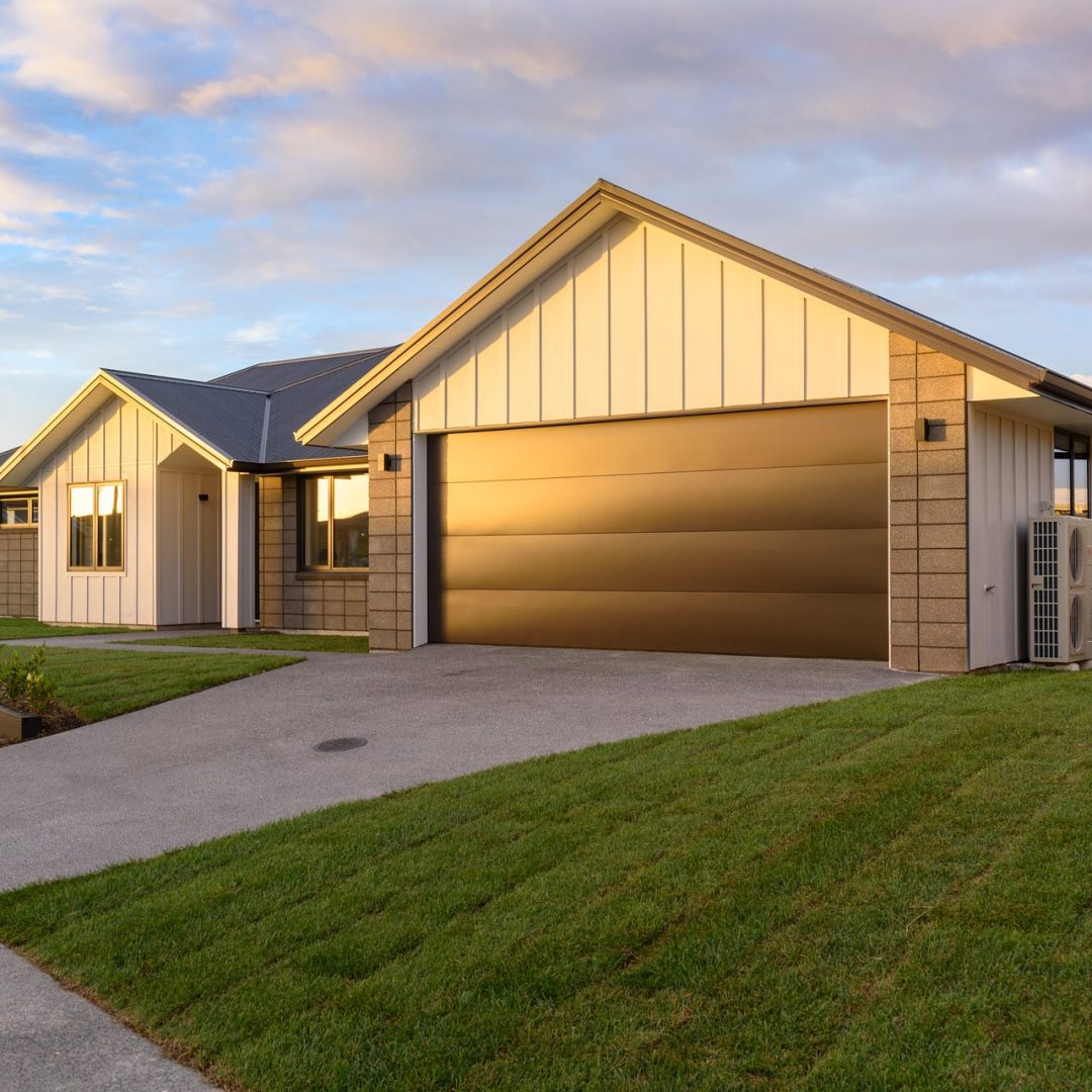 New home modern exterior materials, built by Deluxe Homes.