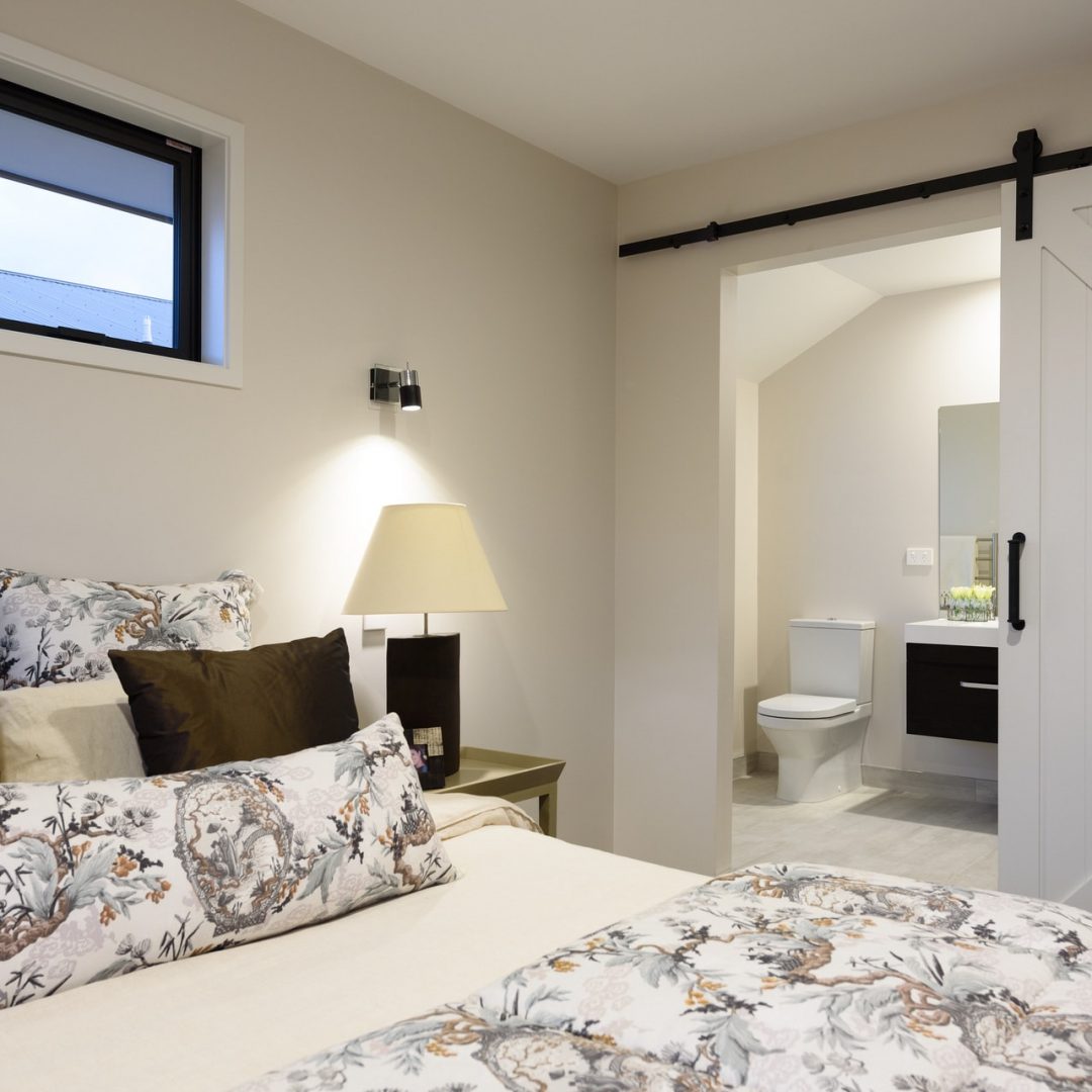 New home modern ensuite with bathroom & shower built by Deluxe Homes.