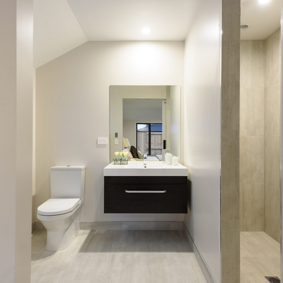 New home modern bathroom & shower built by Deluxe Homes.