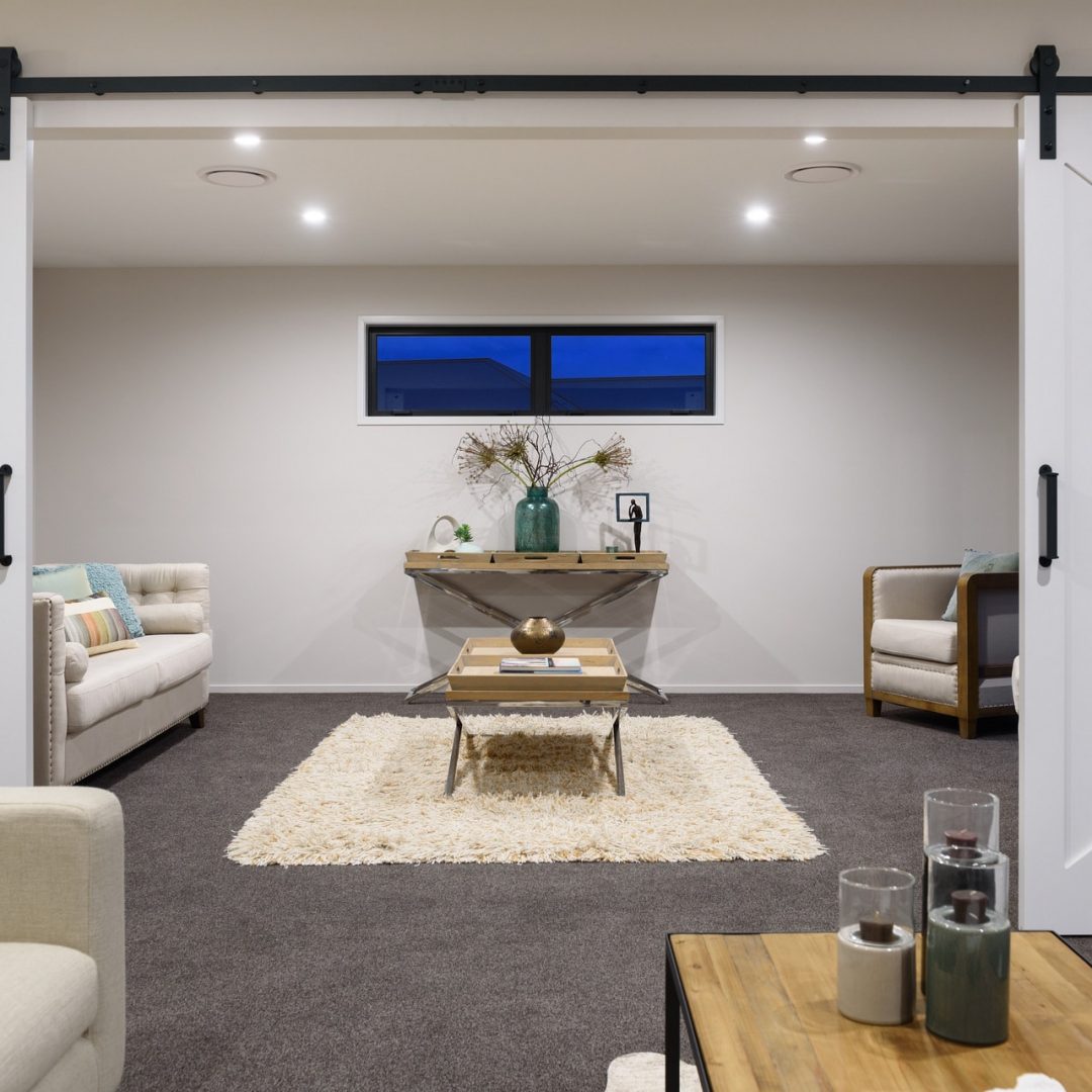 New home with open plan & barn doors designed and built by Deluxe Homes.
