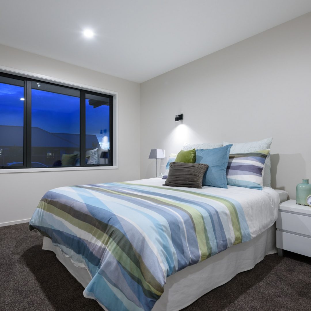 New home guest bedroom designed and built by Deluxe Homes.