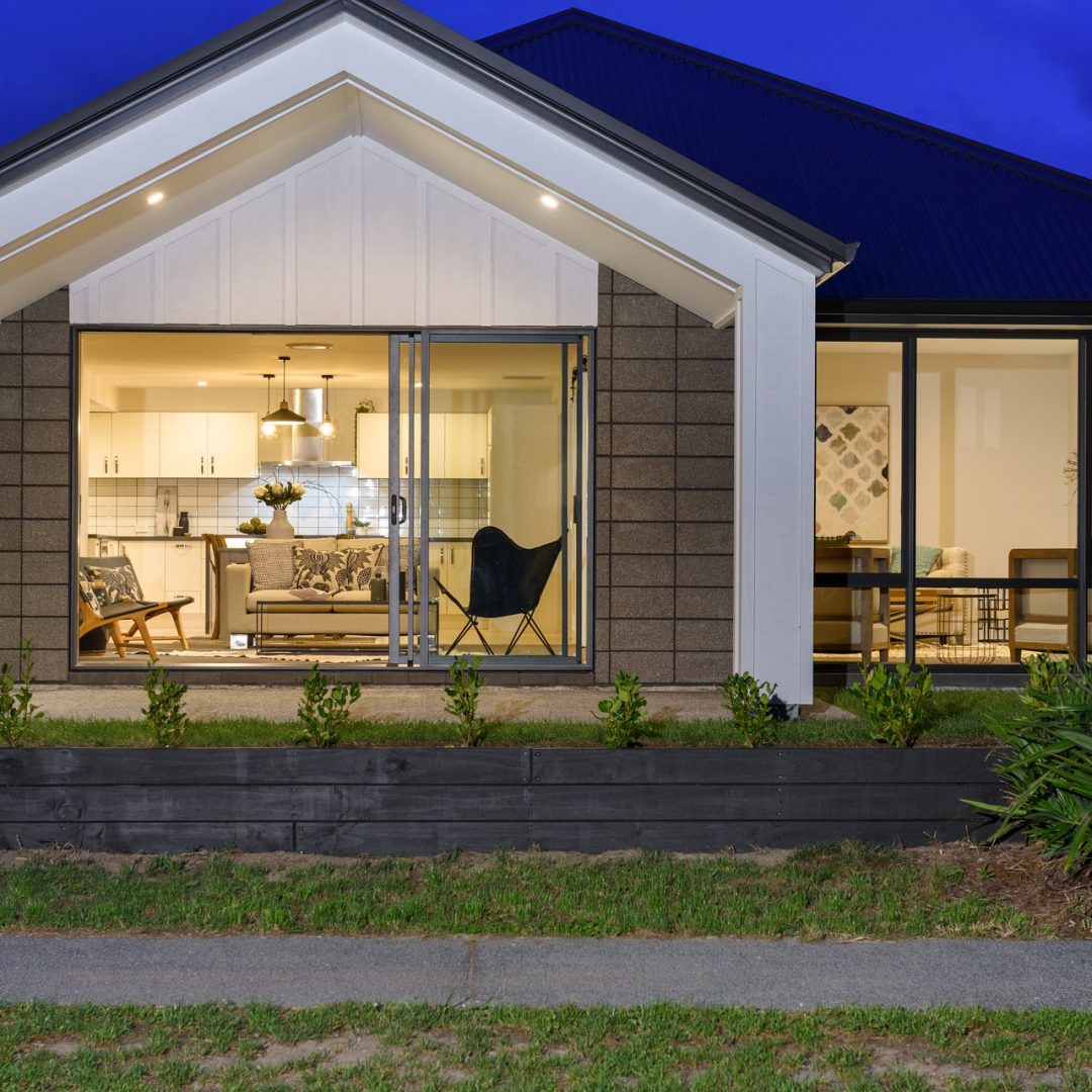 New home with outdoor flow in Papamoa built by Deluxe Homes.